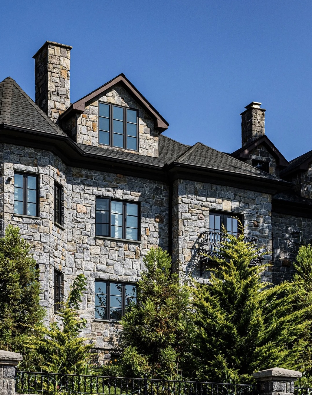 Custom hand-laid stone residence by VIK MGM Corporation in New York