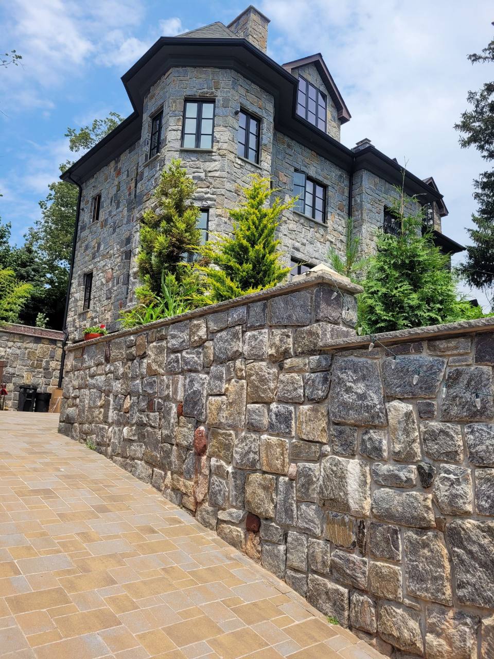 Hand-laid stone tower residence by VIK MGM